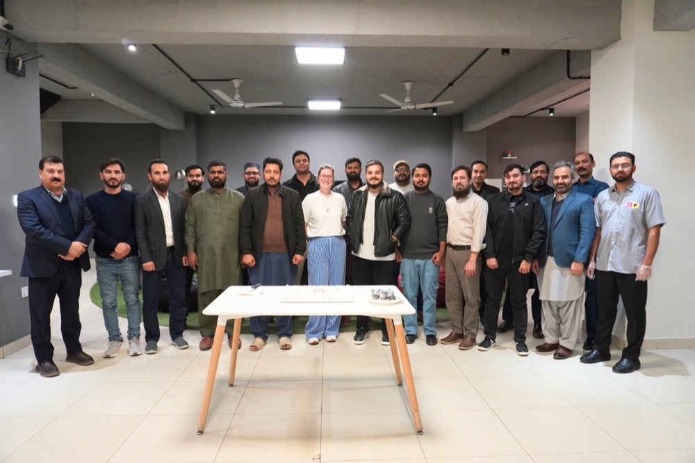 The Zeropoint Pakistan team standing together in the office